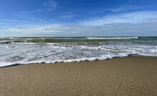 Waves of the sea turn against a breakwater