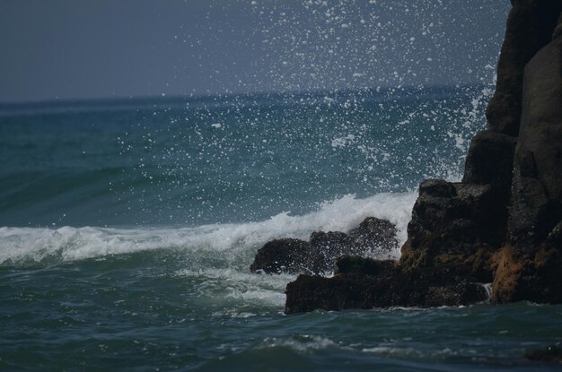 Waves splashing on rocks