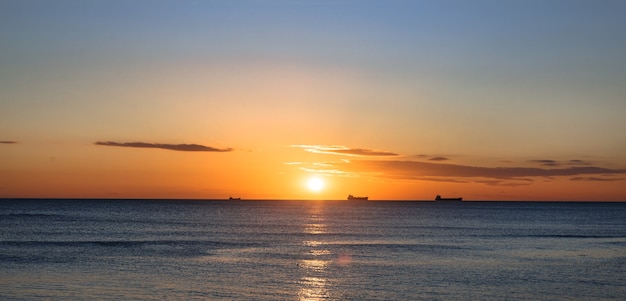 Waves at sunset, the Cold sea in the autumn