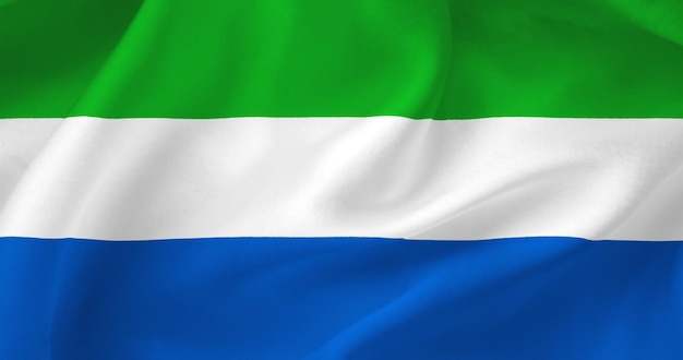 Wavy flag of Sierra Leone Flag of a free country The flag flutters in the wind Textiles satin