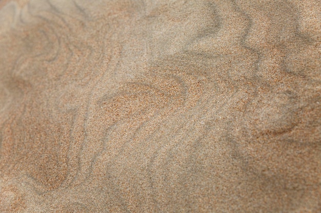 The wavy surface of a sand dune Background Space for text