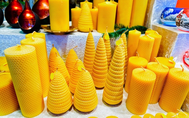 Wax candles at Christmas Market at Gendarmenmarkt square in Winter Berlin, Germany. Advent Fair Decoration and Stalls with Crafts Items on the Bazaar. German street Xmas and holiday in European city