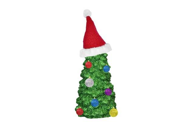 Wax Christmas tree in a red santa hat with balls on a white background.