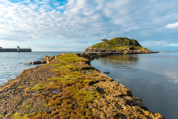 On the way to San Nicolas Island at low tide from Isuntza beach in Lekeitio, Basque Country