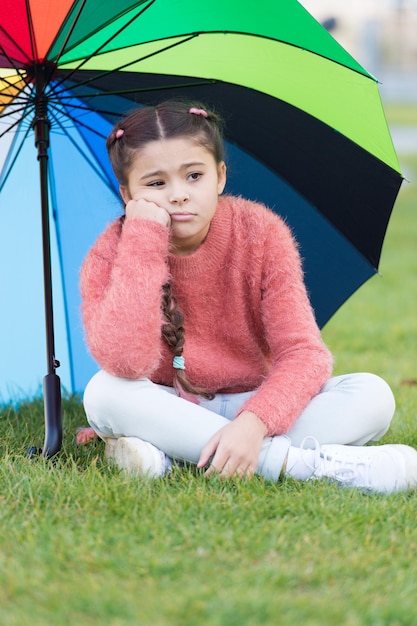 Ways brighten your fall mood Colorful accessory for cheerful mood Girl child long hair sad because of fall weather Stay positive fall season Little girl sad about fall while sit under umbrella