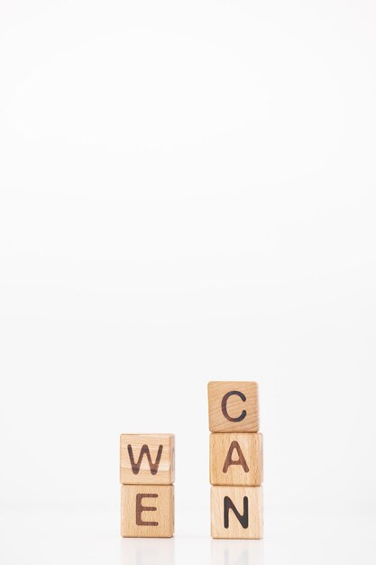 We can word is written on wooden cubes on a white background Closeup of wooden elements