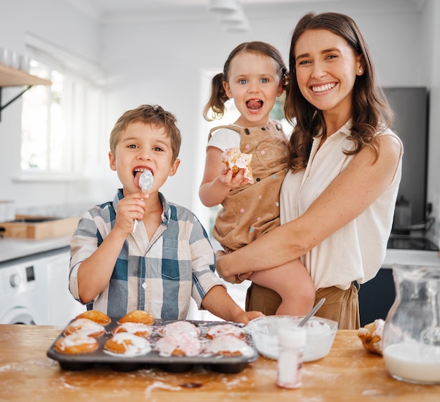 We serve our guest homemade goodness. Shot of a woman baking with her two children at home.