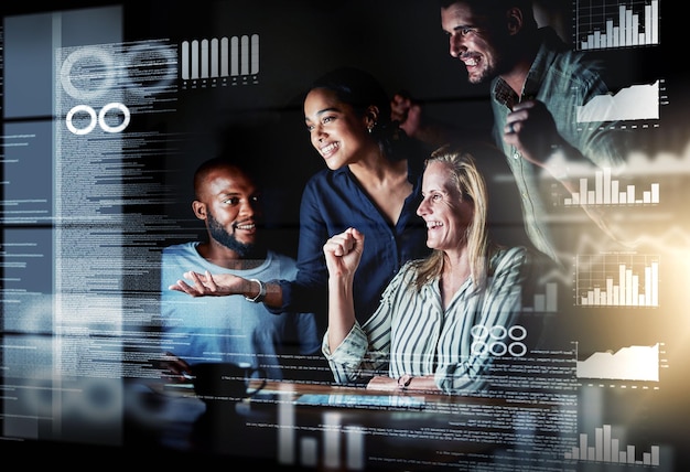 We totally cracked it shot of a group of programmers working together on a computer code at night