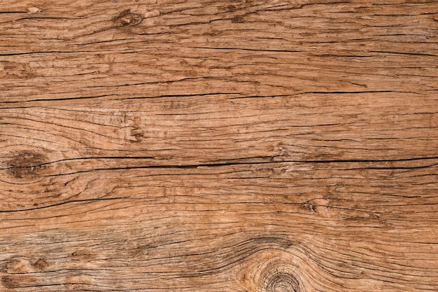 Weathered brown wood texture with knots and grain patterns