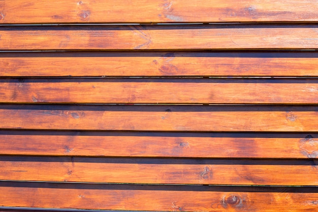 Weathered orange fir planks on wall, texture 