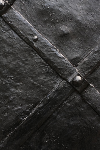 Weathered and rusty decoration element of vintage metal doors