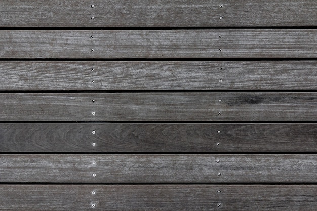 Weathered wooden plank floor texture. Wood pavement background. Abstract home deck pattern