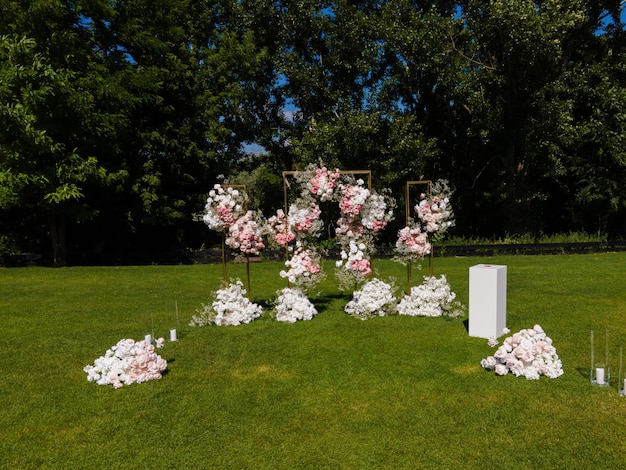 wedding arch of foliage and white and pink flowers