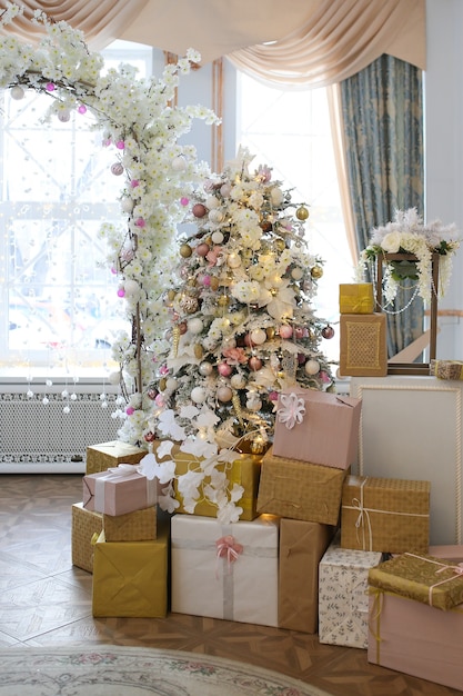 Wedding arch made of Christmas decorations tree and gifts