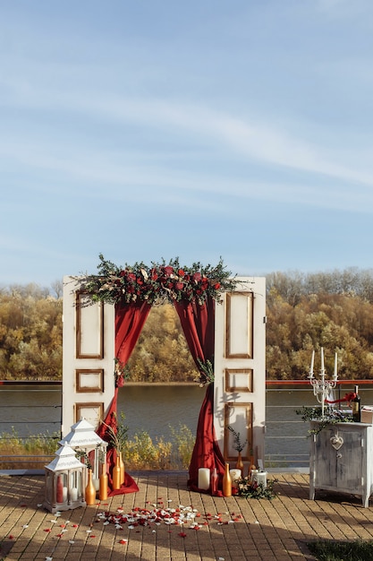 Wedding arrangement with doors and roses