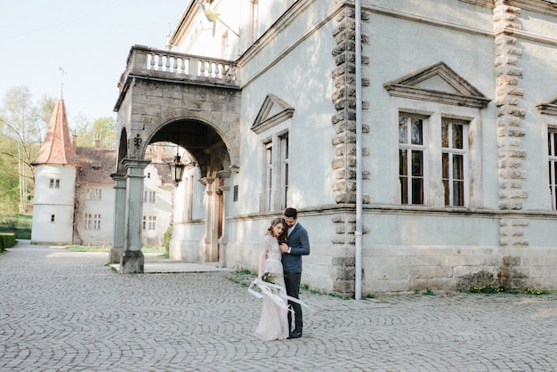 Wedding beautiful couple in the evening in a castle