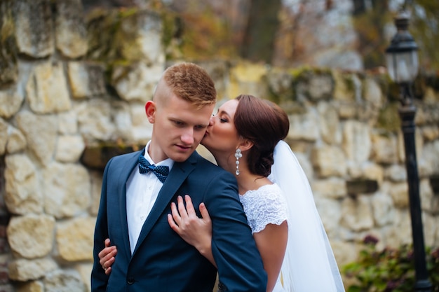 Wedding beautiful young couple stand on street