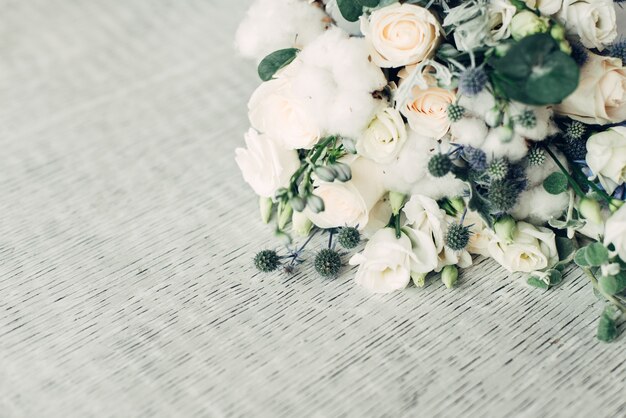 Wedding bouquet on gray background, free space for design