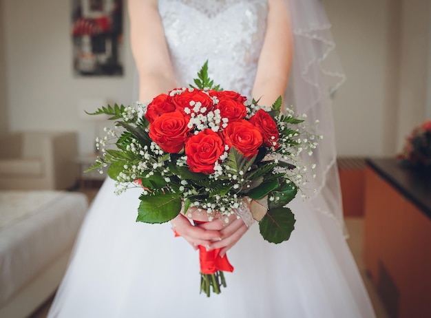 Wedding bouquet in hands of the brid