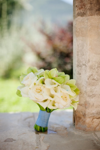 Wedding bouquet orchids and peonies Fine art wedding bouquet and flowers background