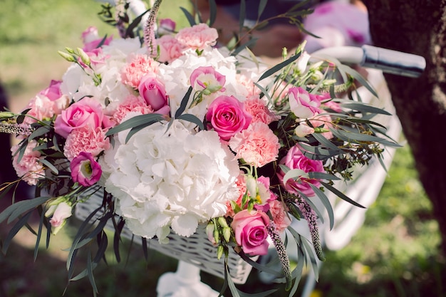 Wedding bouquet of peonies in in the basket