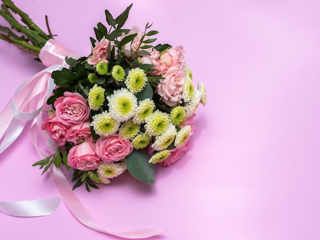 Wedding bouquet on a pink background. Copy space.