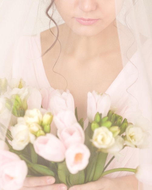 Wedding bouquet of tulips in bride's hands