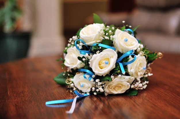 Wedding bouquet on the wooden table