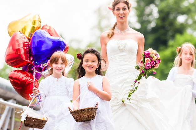 Wedding Bride in gown with bridesmaid