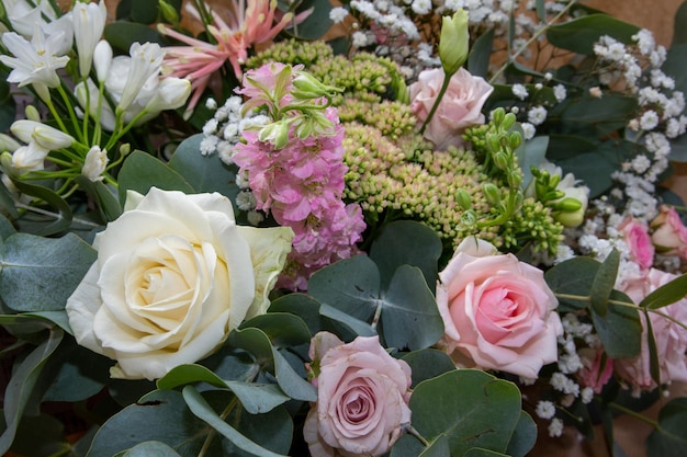 Wedding bride pink green white close up on bouquet flowers in marriage