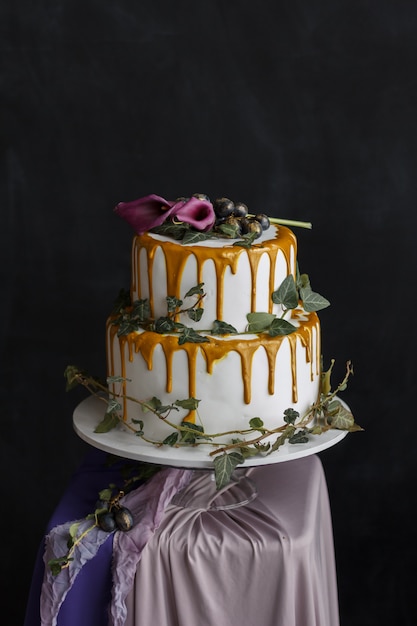 wedding cake with cream and flowers