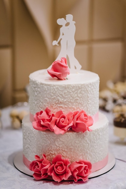 Wedding cake with flowers for a wedding banquet Delicious reception Copy space Celebration party concept Trendy Cake