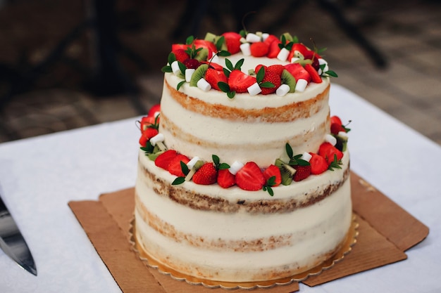 Wedding cake with fresh strawberries