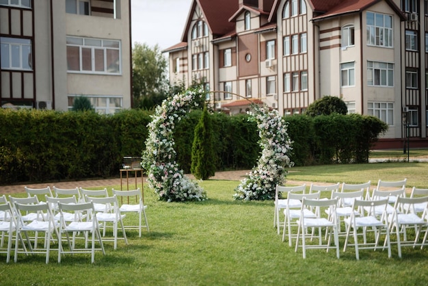 Wedding ceremony area arch chairs decor