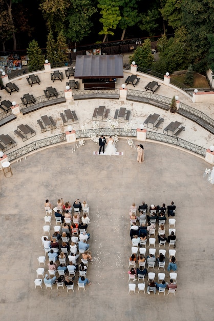 Photo wedding ceremony area with rows of guests top view