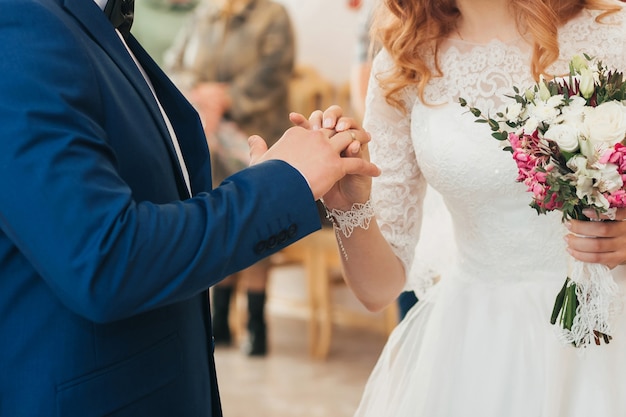 Wedding ceremony of exchange of rings between the bride and groom