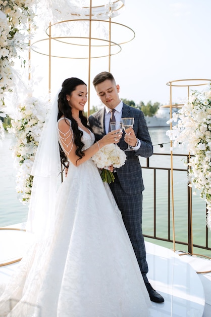 Wedding ceremony of the newlyweds on the pier