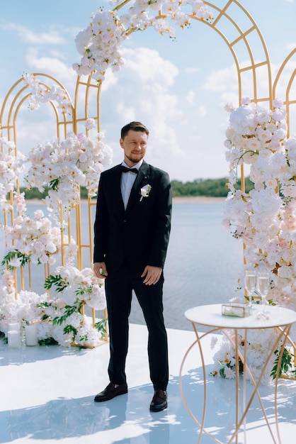 wedding ceremony of the newlyweds on the pier