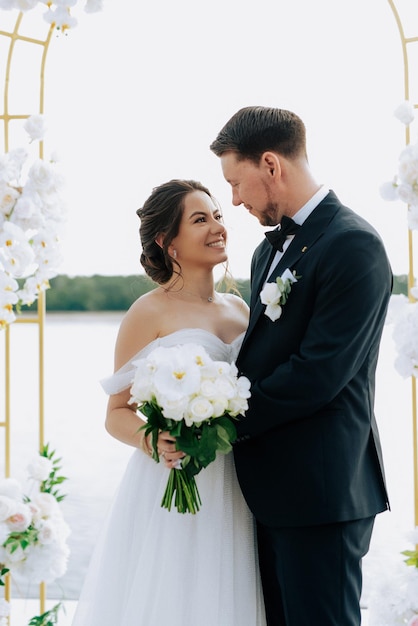 wedding ceremony of the newlyweds on the pier