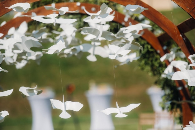 Wedding ceremony on the street on the green lawnDecor with fresh flowers arches for the ceremony