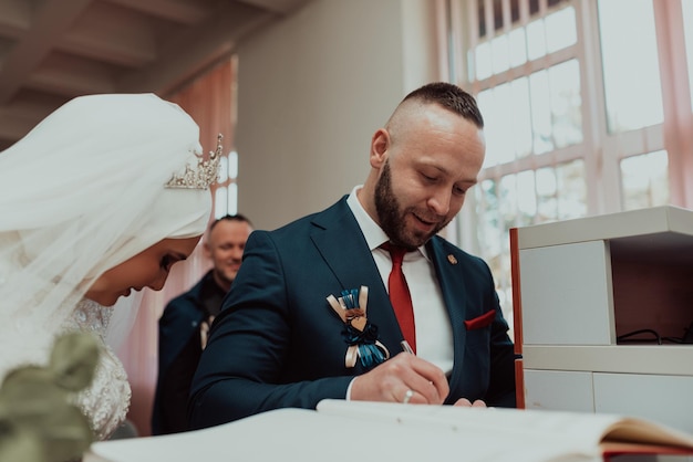 Wedding ceremony Wedding couple leaving their signatures Selective focus