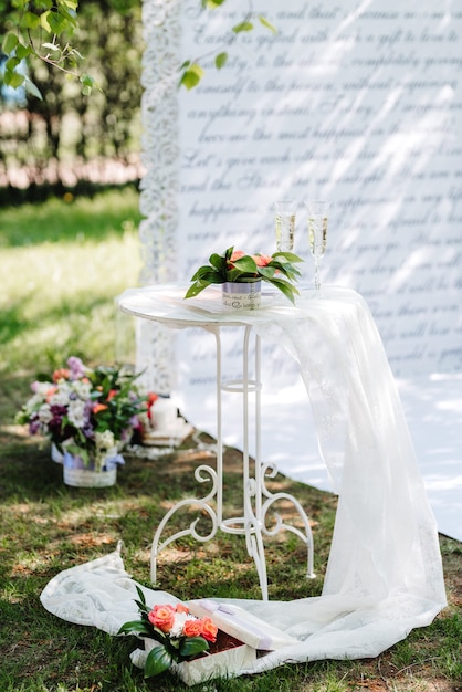 Wedding ceremony in the woods among the trees on the green track