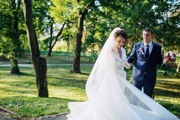 Wedding couple dancing in the park