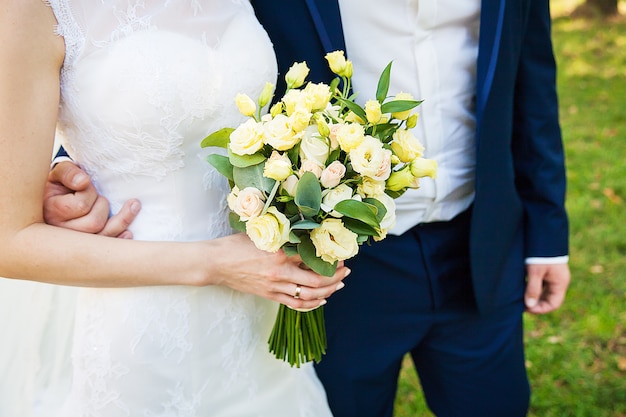 Wedding couple details. No face, only body and hands.