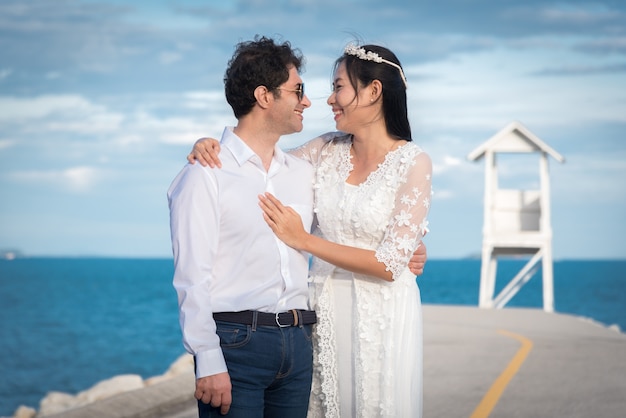 Wedding couple next to the sea