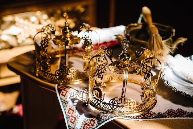 Wedding crowns in church ready for marriage ceremony close up