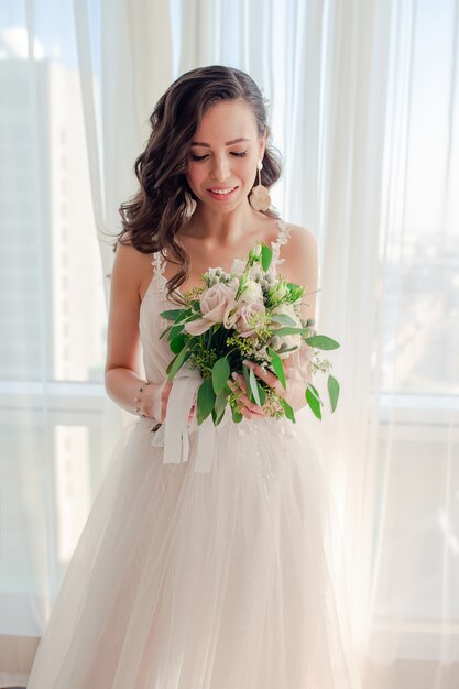 Wedding day. Portrait of beautiful bride with bouquet