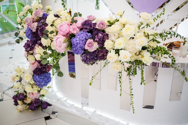 Wedding decor made of flowers and fabric. Beautiful decorations for newlyweds on their wedding day