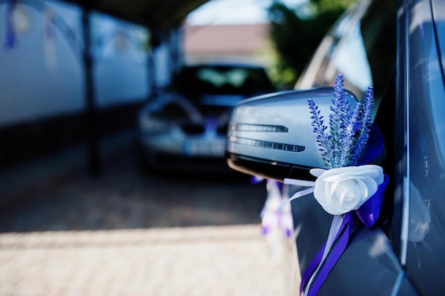 Wedding decoration of lavender in mirror of car