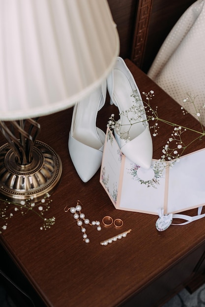 Wedding decorations are waiting in the wings on the bedside table 3767